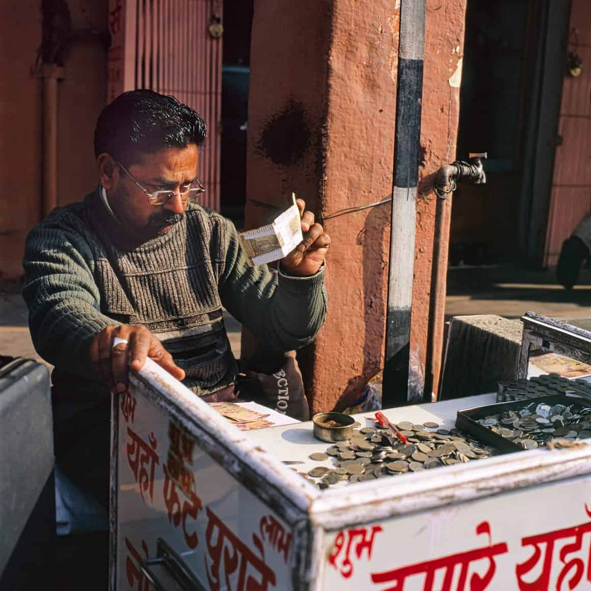 Indian man holding currency