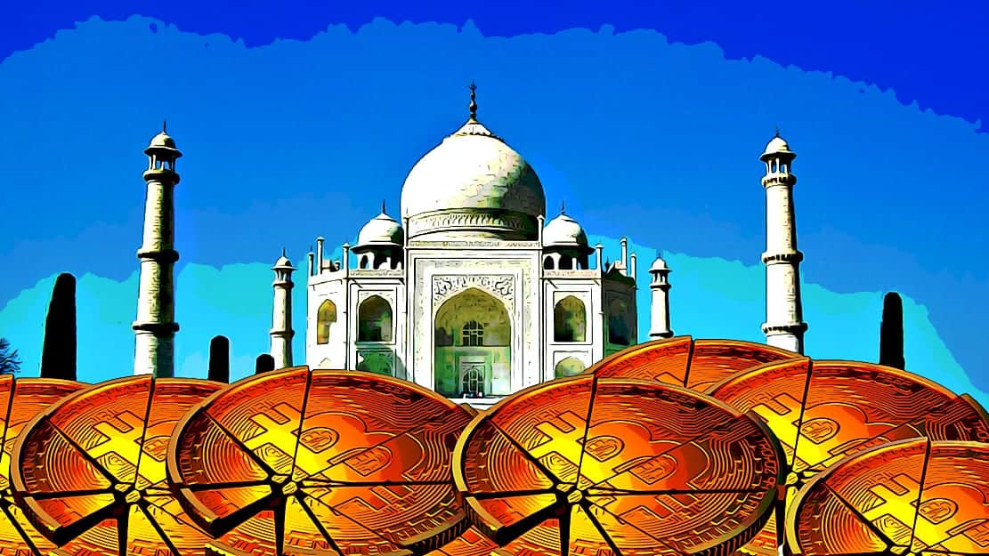 Crack bitcoin stacked in front of Taj Mahal
