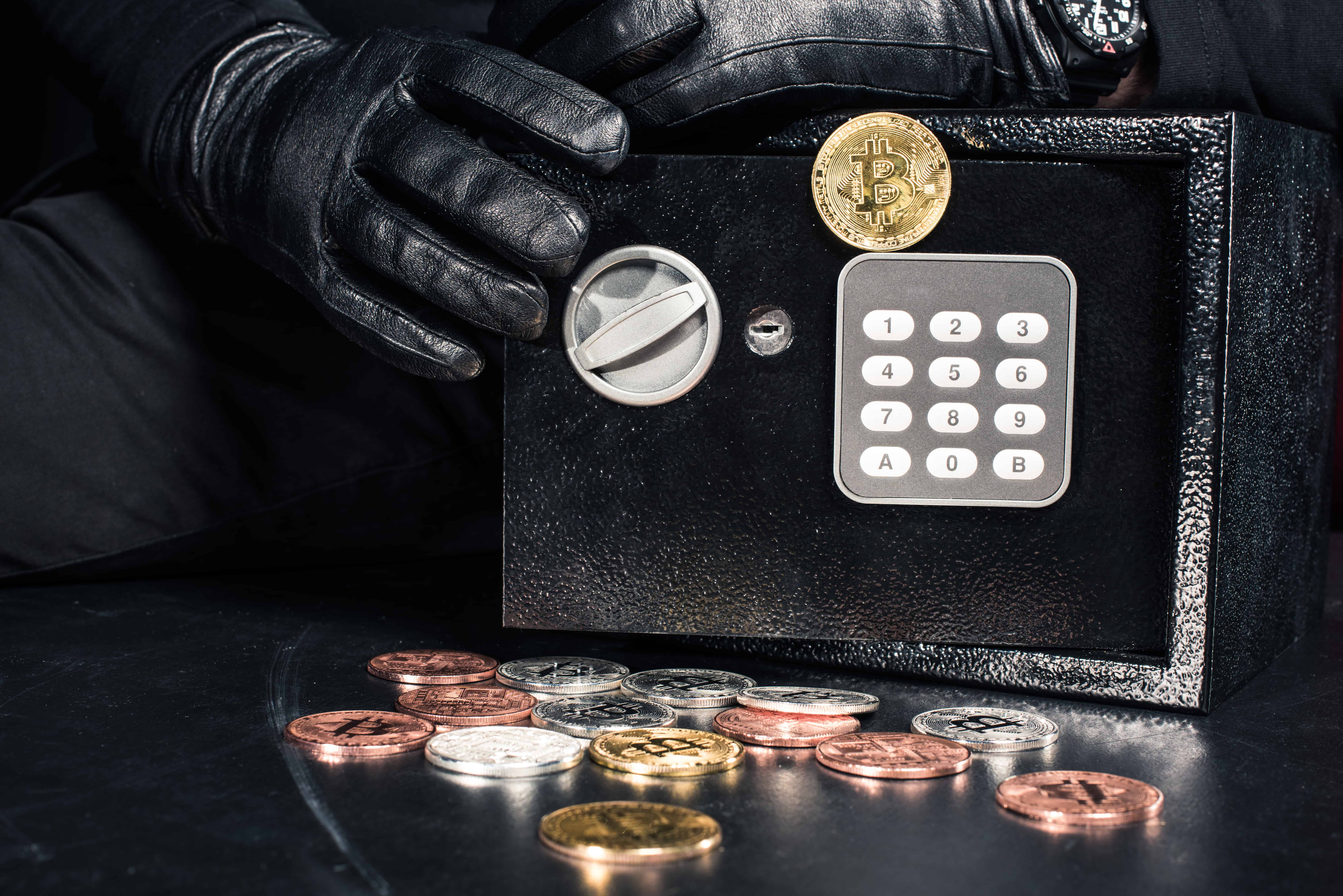 Close-up view of man opening safe with bitcoin cryptocurrency | Turkey sweeps Bitcoin ban under the rug