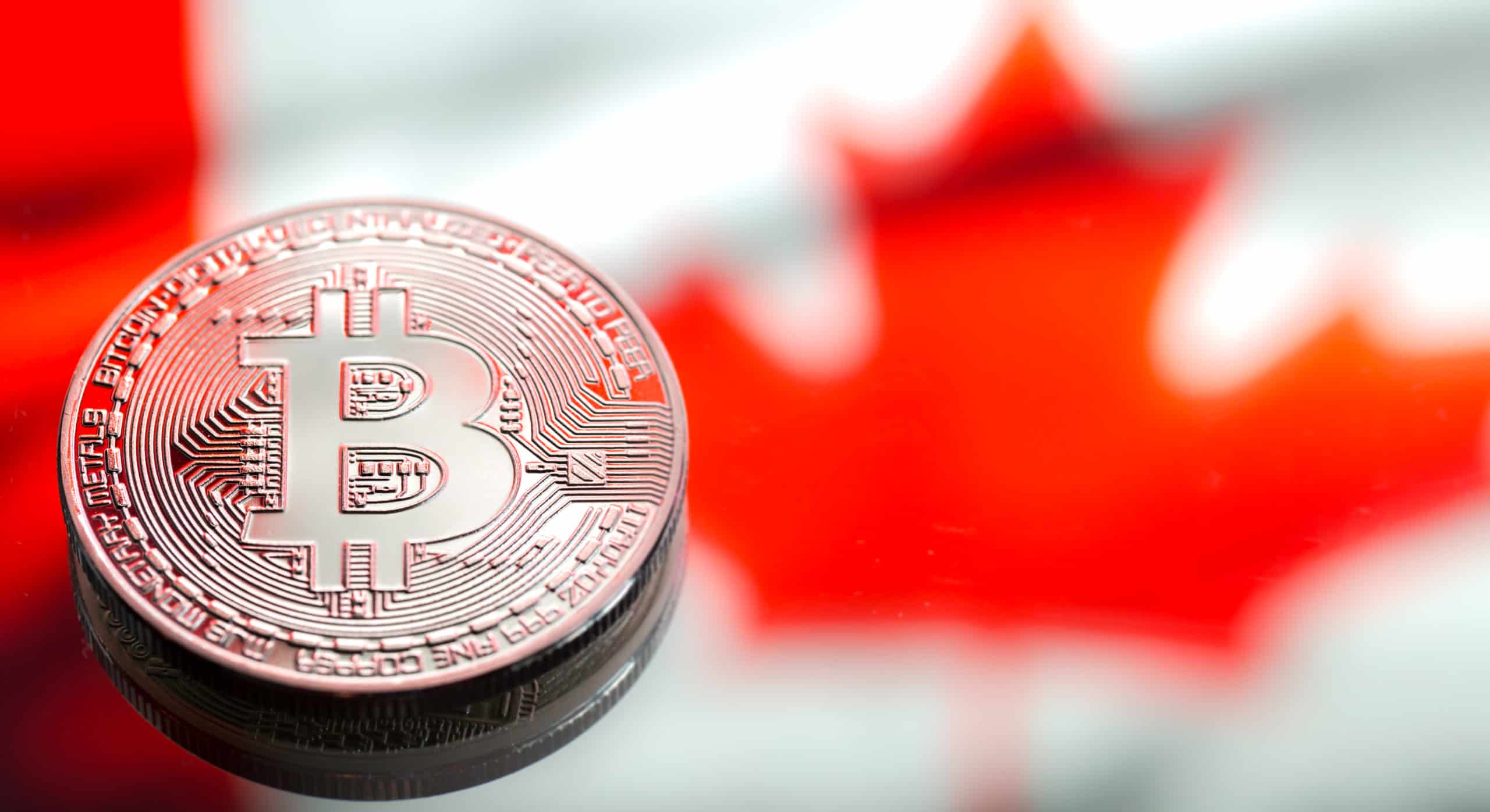 coins Bitcoin, against the background of Canada flag, concept of