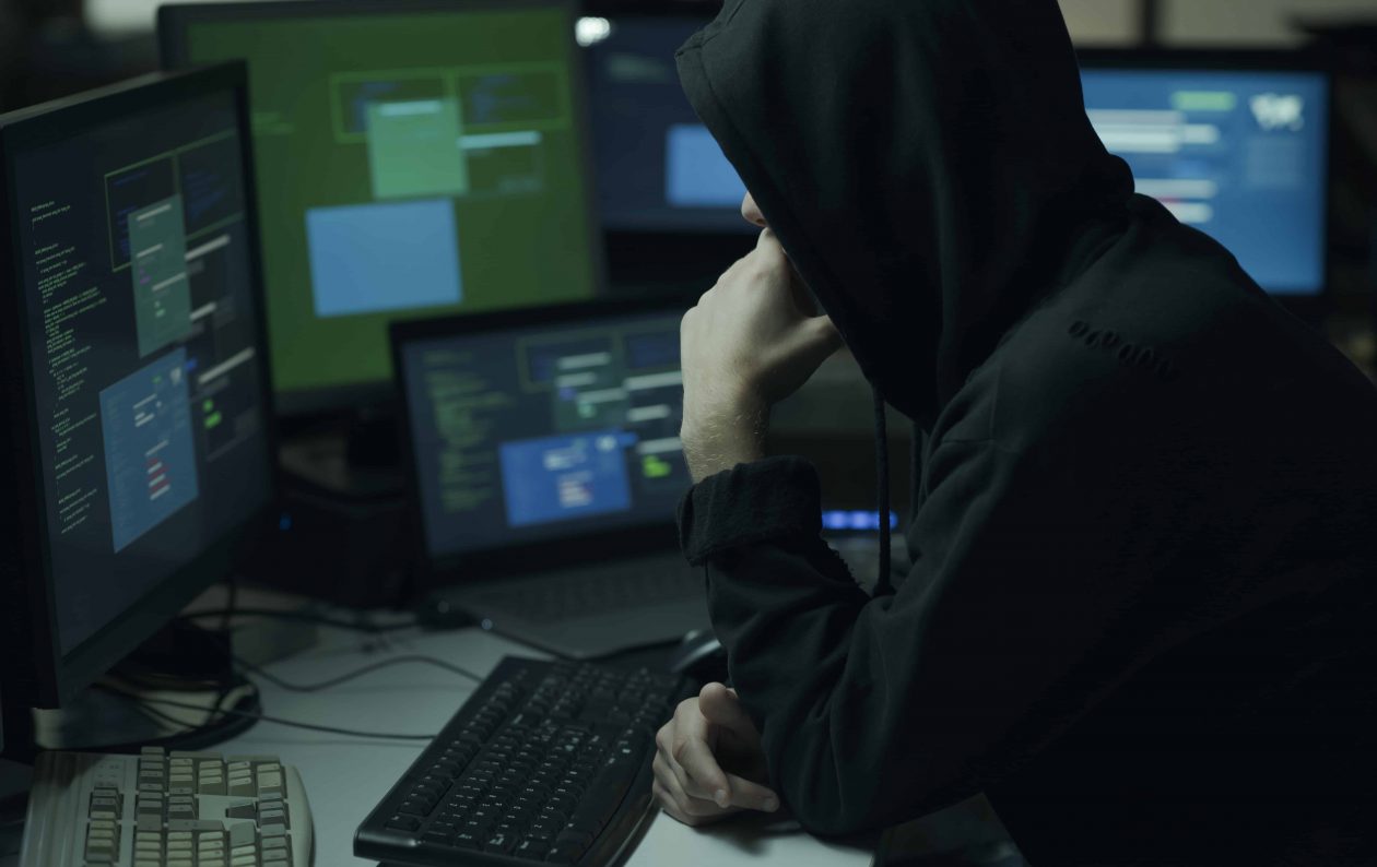 hacker with hoodie working with a computer 36BVHPD