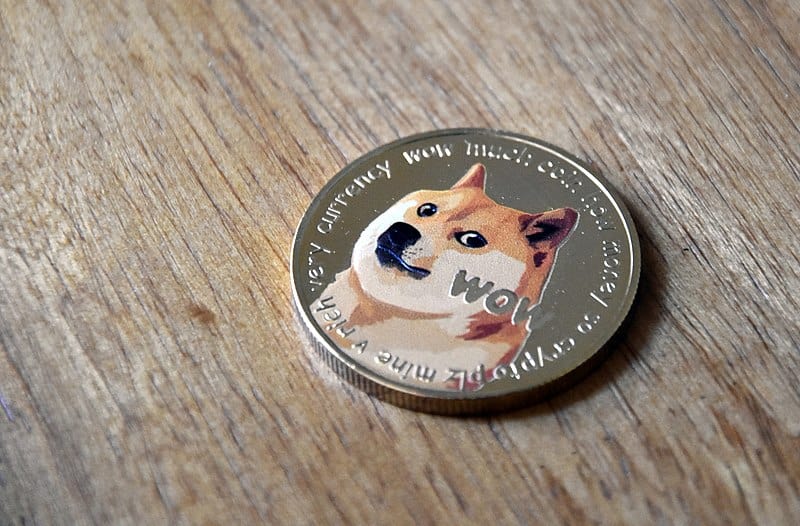 Dogecoin_gold_coin_on_wood_2_-_heads