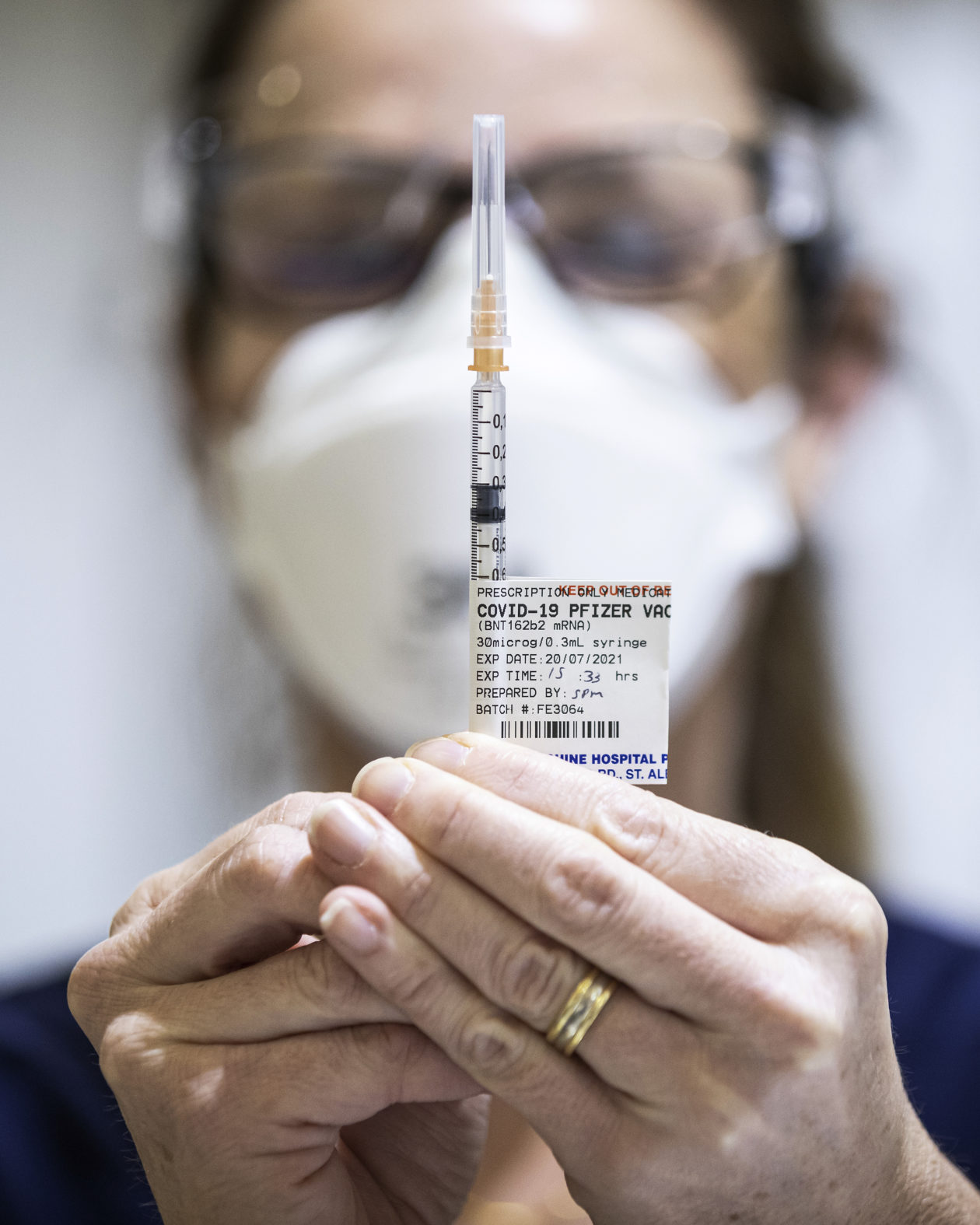 Staff are seen preparing Pfizer vaccine doses inside the Melbourne Showgrounds COVID-19 Vaccination Centre on July 20, 2021 in Melbourne, Australia
