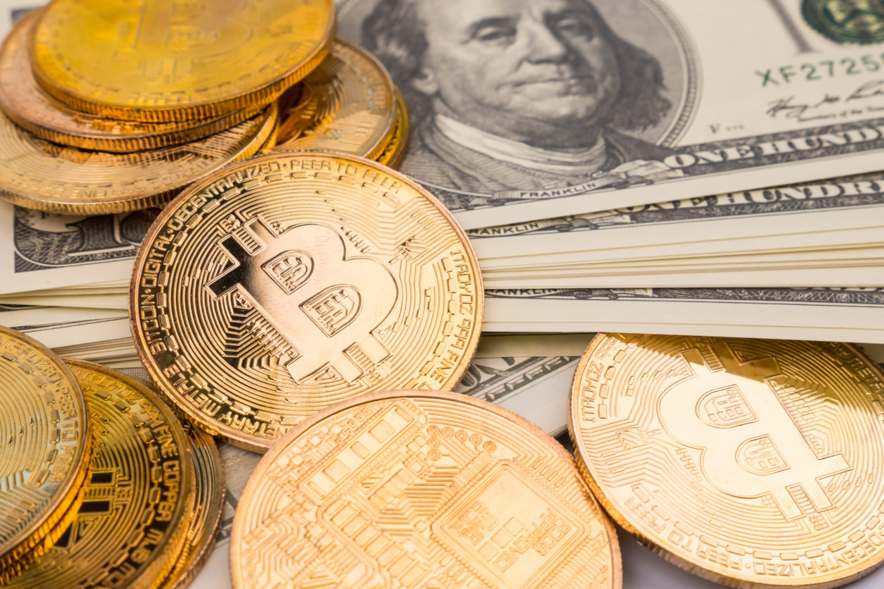 golden bitcoins of new digital money on banknotes 2021 09 03 12 19 35 utc