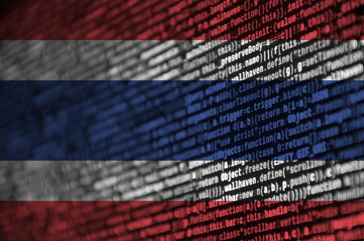 Flag of Thailand depicted with code, Thai tourism tries to attract crypto holders