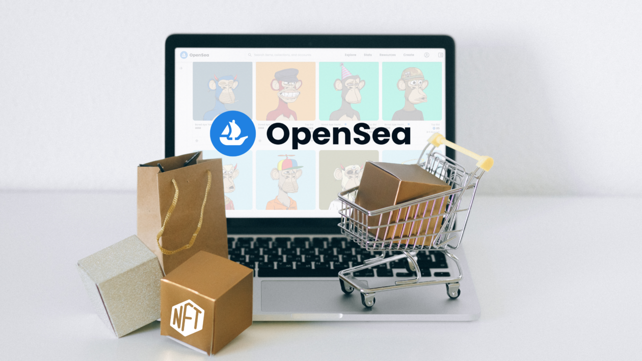 OpenSea NFT marketplace logo on laptop with shopping carts and bags placed in front.