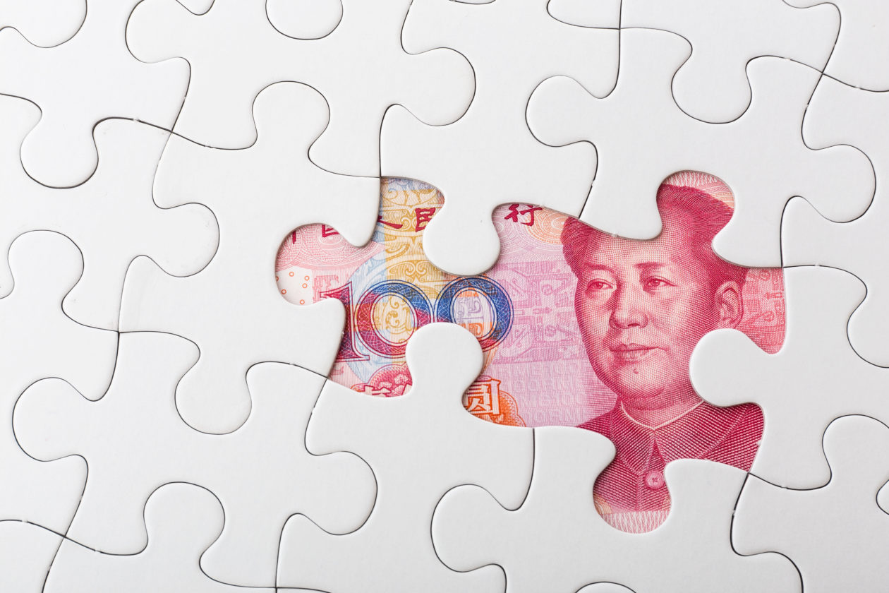 Chinese yuan and puzzle piece