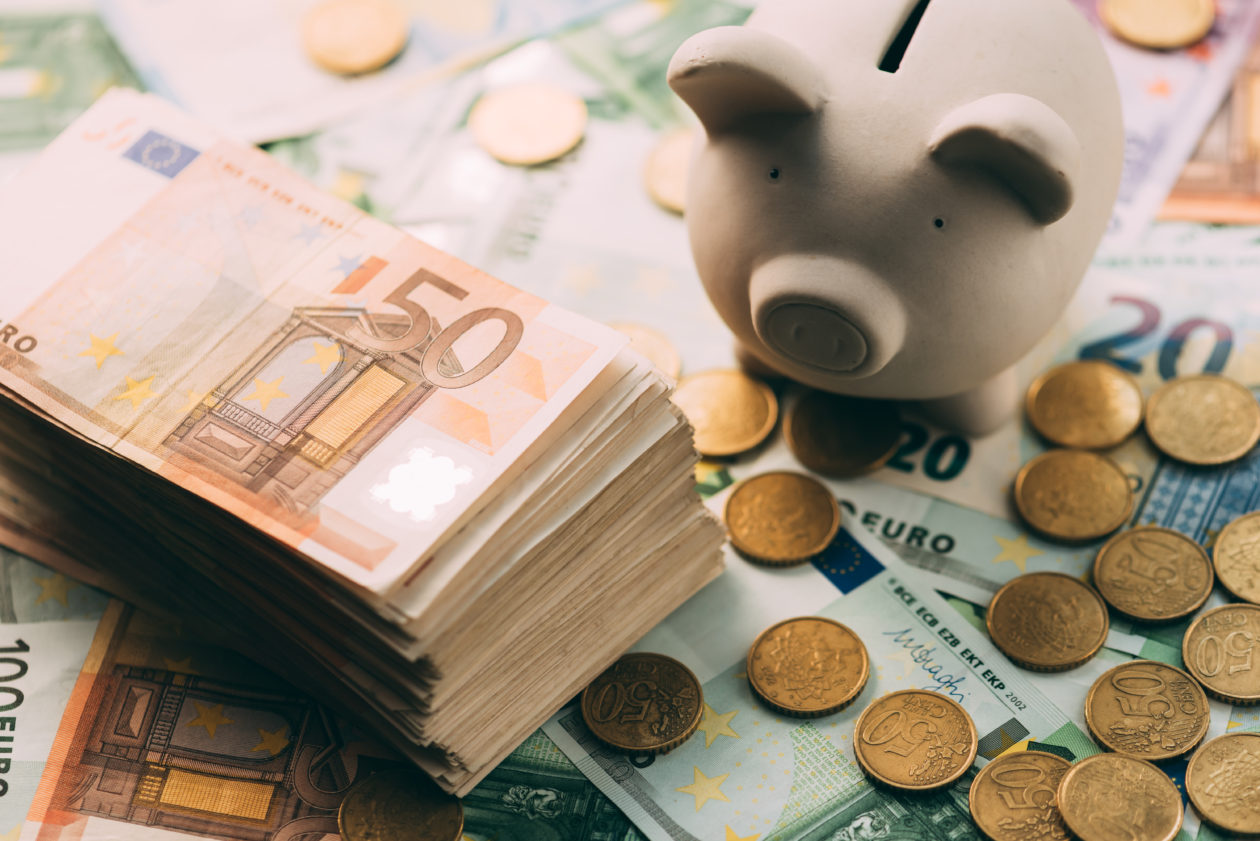 USDC operator Circle introduces new Euro Coin stablecoin, Piggy moneybox with euro cash and coins closeup. Financial concept