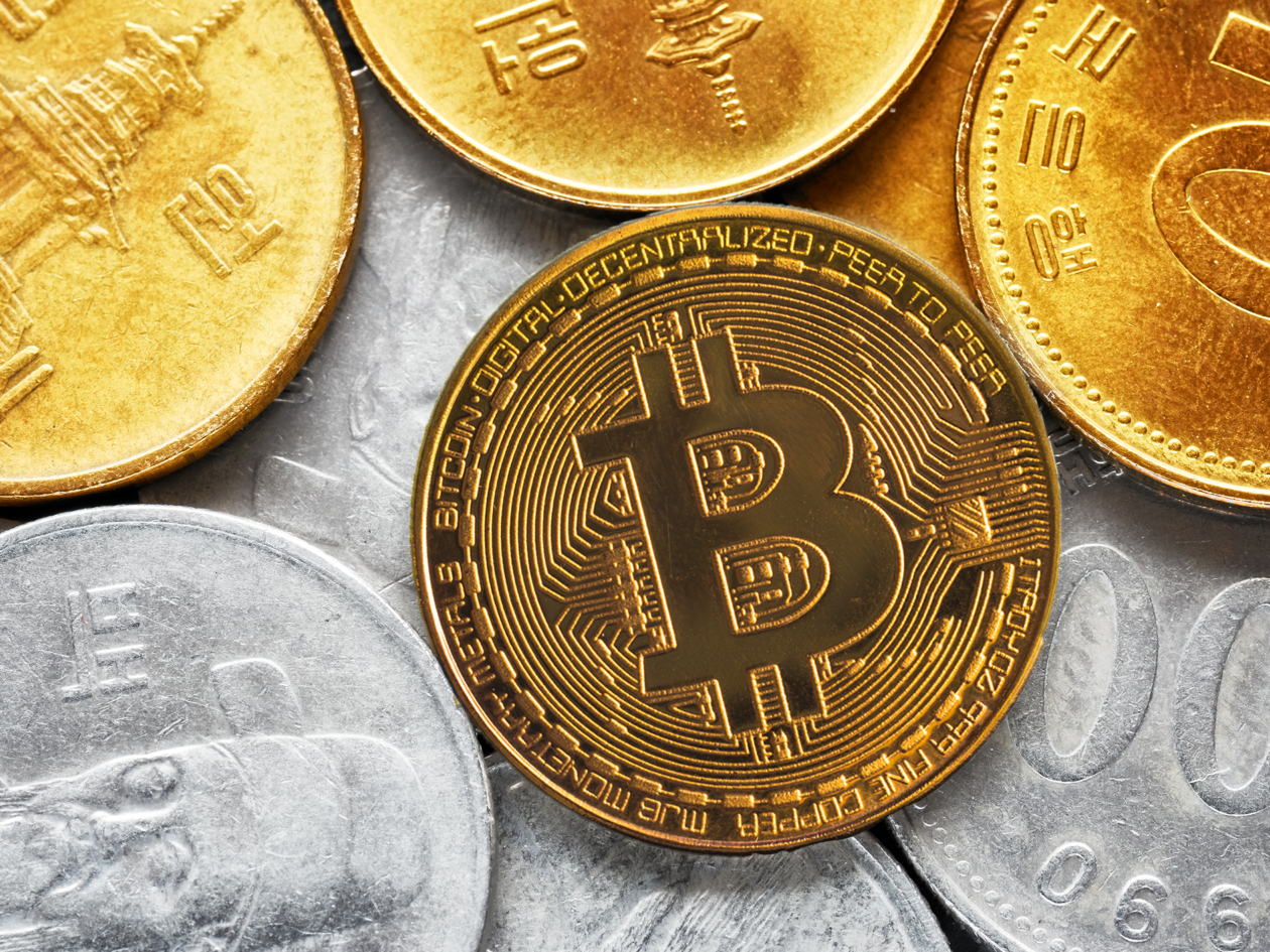 Bitcoin token surrounded by South Korean won coins | South Korea’s top financial regulator to accelerate new crypto legislation | south korea, south korea crypto, crypto regulation, yoon suk yeol, kim joo hyun, south korea fsc