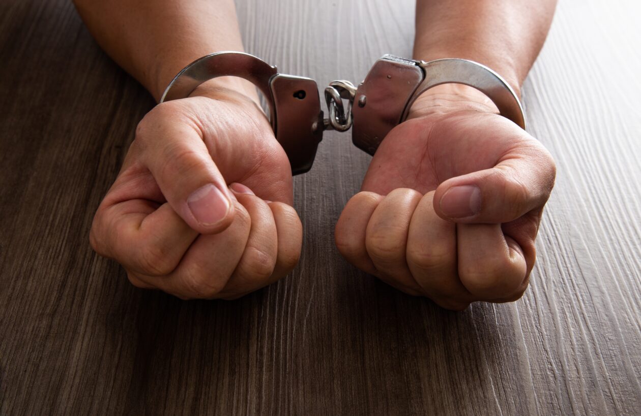 Arrested criminal hands locked in handcuffs | South Korea issues arrest warrant for Terraform Labs CEO Do Kwon | Do Kwon news, Do kwon arrest, terra luna news, south korea terra luna