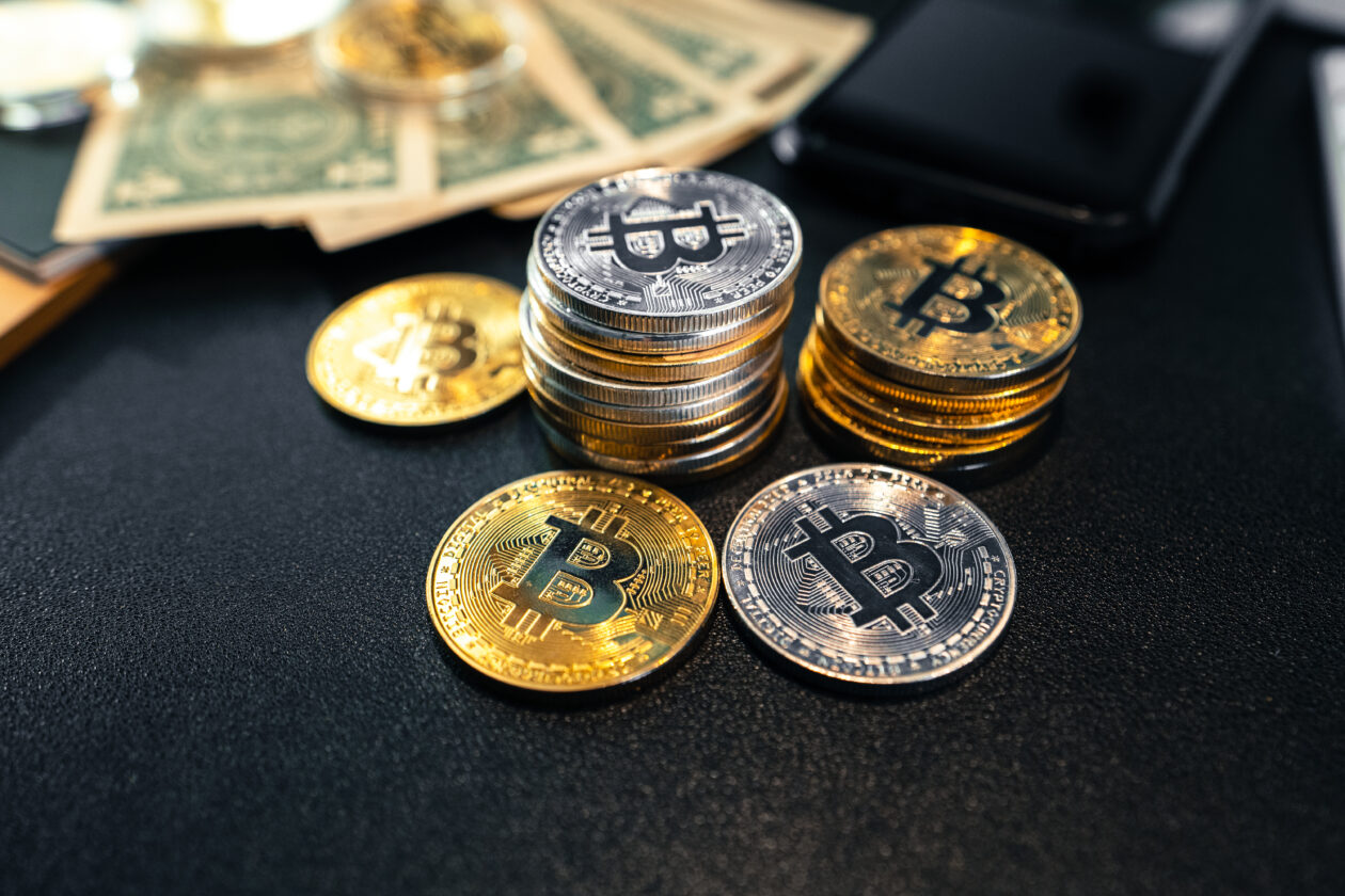 Bitcoin coins and money on the business desk