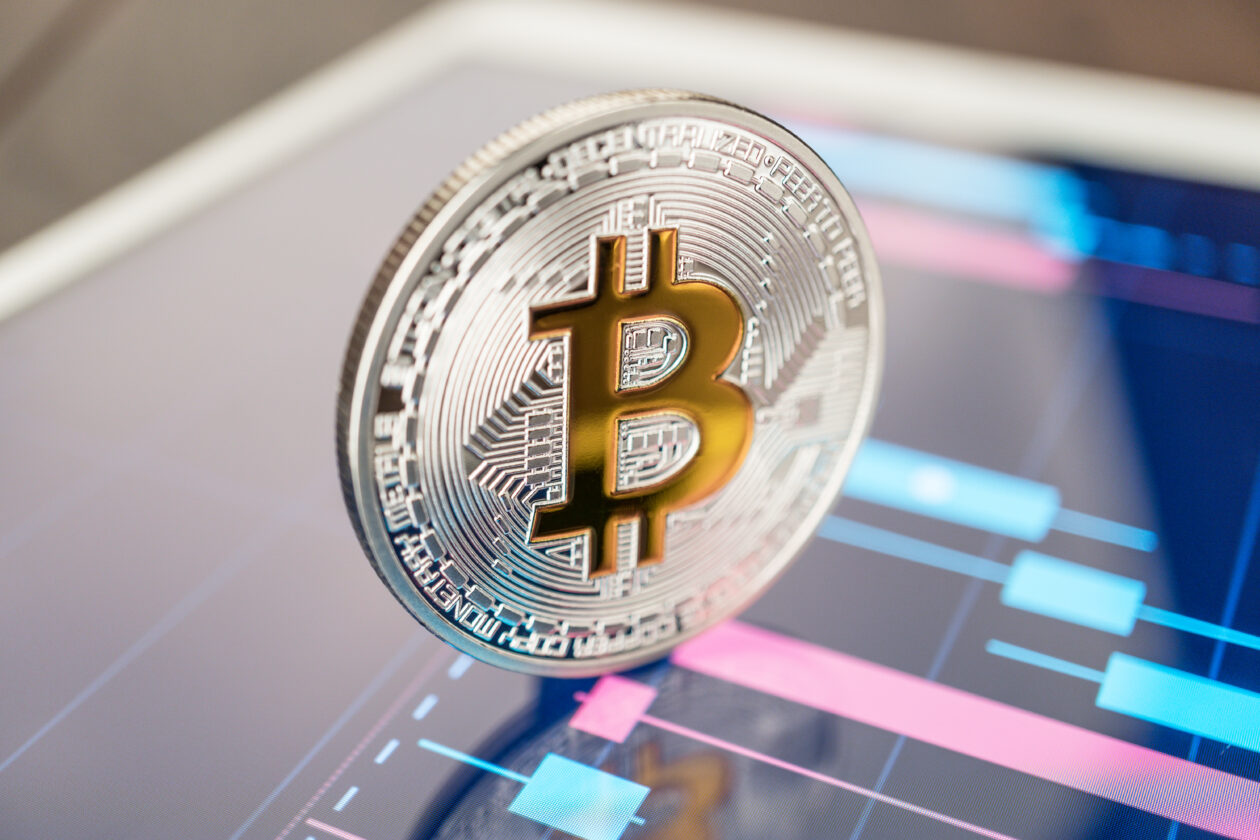 Bitcoin sitting on a tablet. | Crypto lender BlockFi faces possible bankruptcy amid FTX collapse