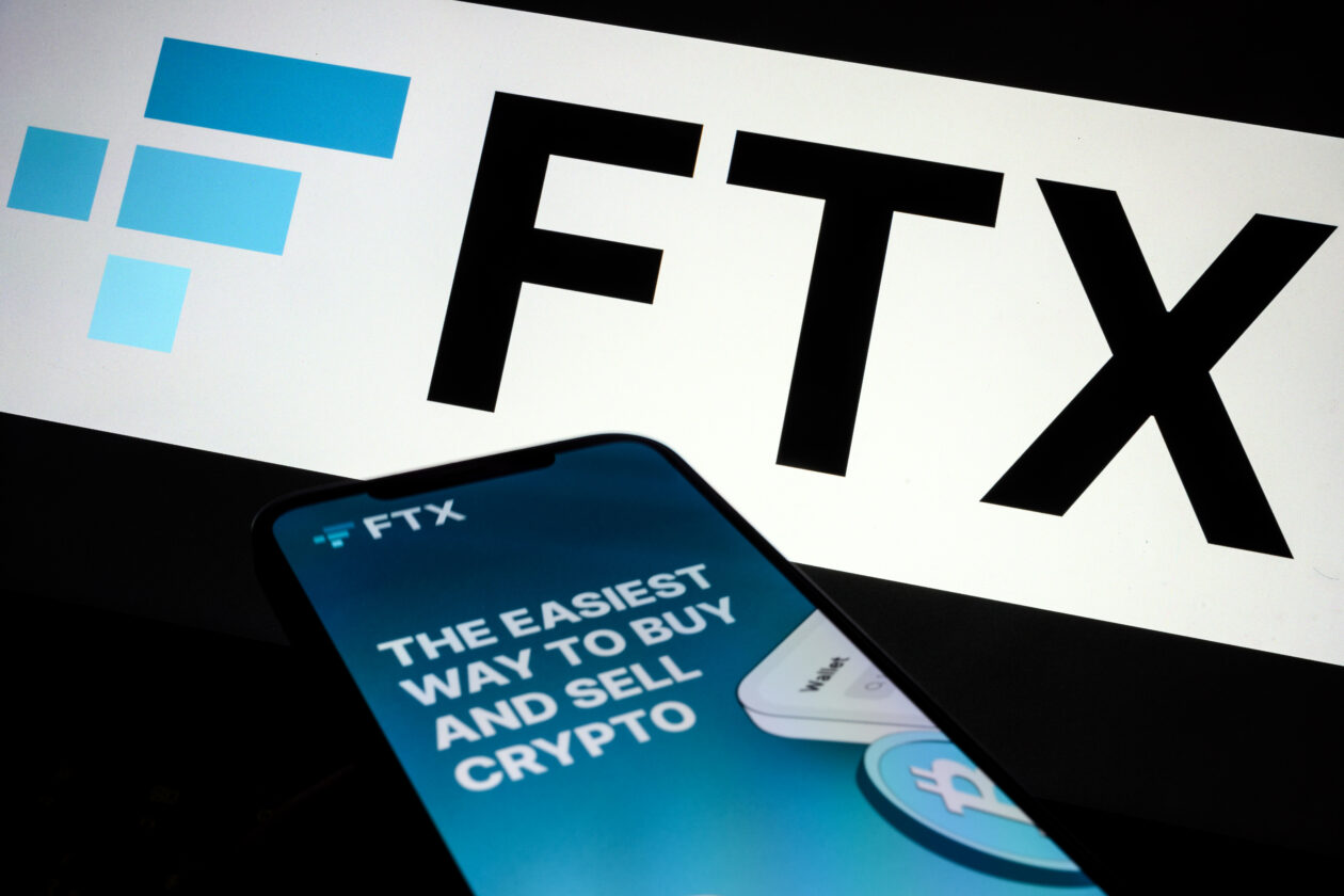 In this photo illustration the FTX logo and mobile app adverts are displayed on screens on November 10, 2022 in London, England.