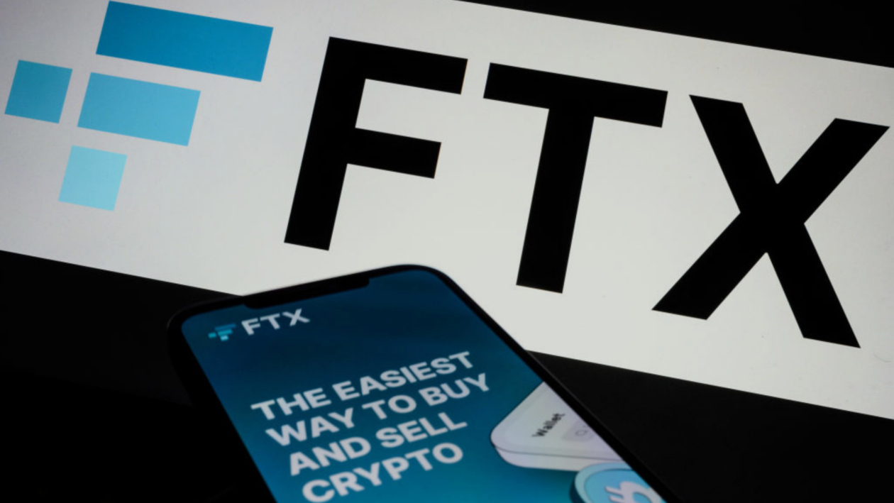 Logo of FTX and mobile phone