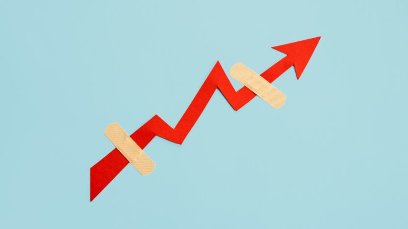 Binance the winner in FTX saga, set to gain more customers 3 Global economy recovery, Business Economic growth. Financial, industrial and market sector comeback and upturn concept. Paper red arrow graph with medical plaster going upward in blue background.