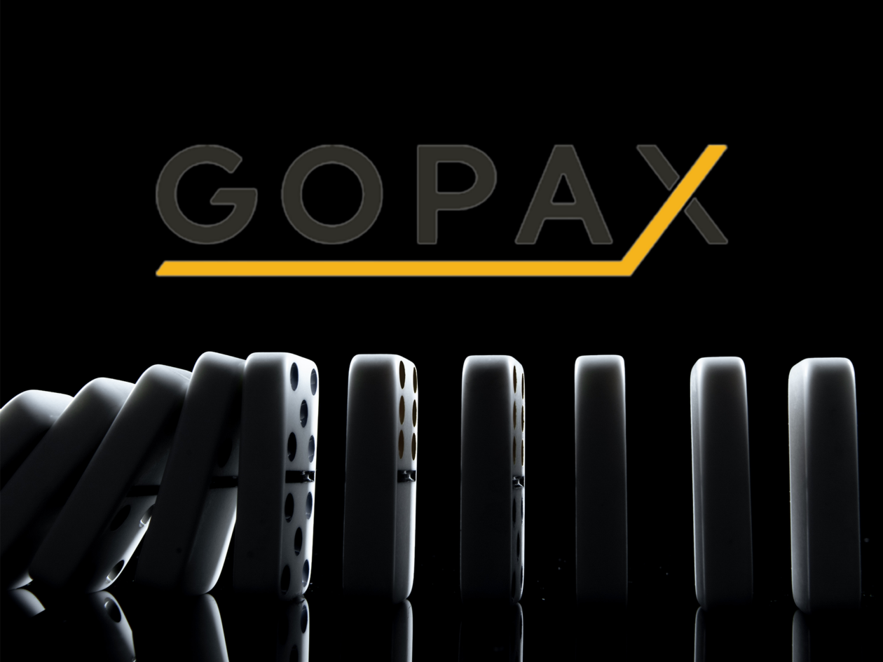 gopax logo and falling dominoes | FTX contagion reaches Korea: local exchange GOPAX halts Genesis-backed DeFi service | ftx, genesis, genesis crypto, gopax
