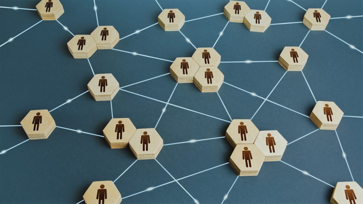 Connected people. Interactions between employees and working groups. Networking communication. Decentralized hierarchical system of company. Partnerships, business connections. Organization concept