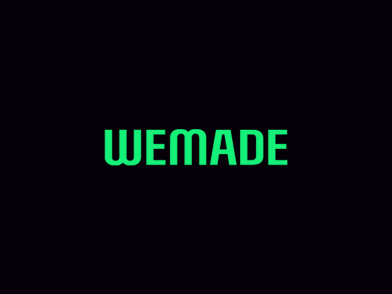 wemade logo and black background | S.Korea’s Wemade files injunction against country’s top 4 crypto exchanges | wemade, henry chang, wemix, upbit, wemix delisting, wemix price