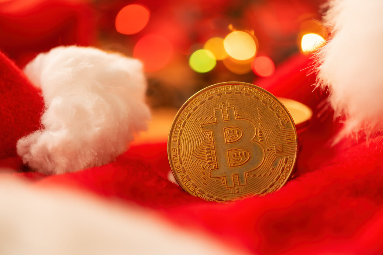 Bitcoin coin with Christmas holiday season decoration, coin stac