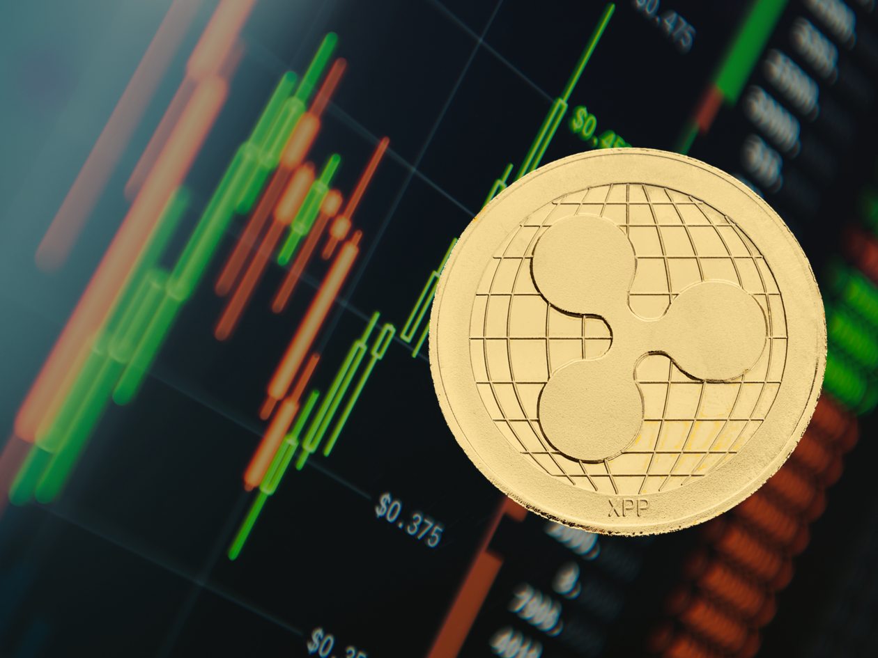 Ripple XRP token and market screen backdrop | Markets: Bitcoin, Ether inch up; XRP biggest loser among top 10 | bitcoin price today, ether price today, crypto market today, crypto price, xrp news