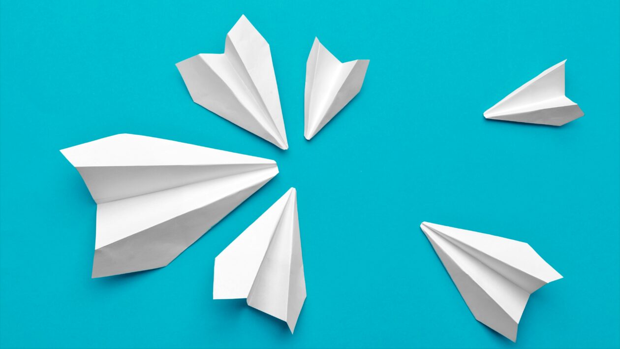 Telegram white paper airplane on a blue background