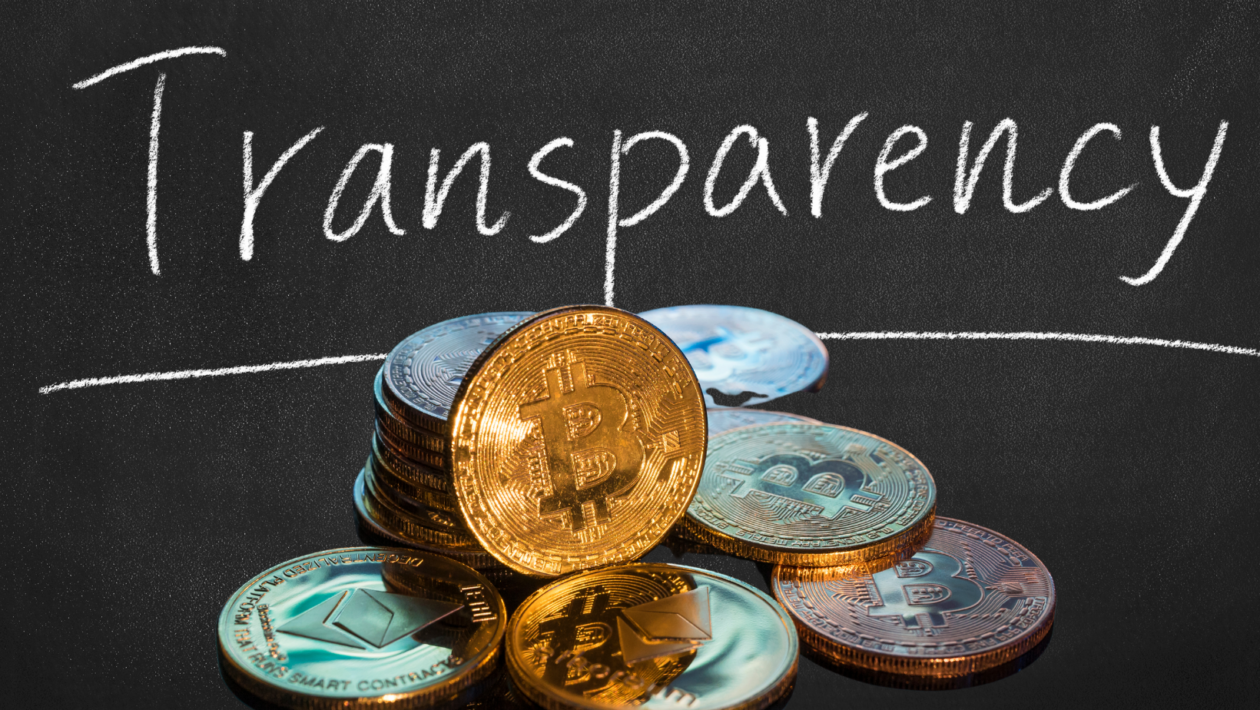 pile of cryptocurrency coins under the word transparency
