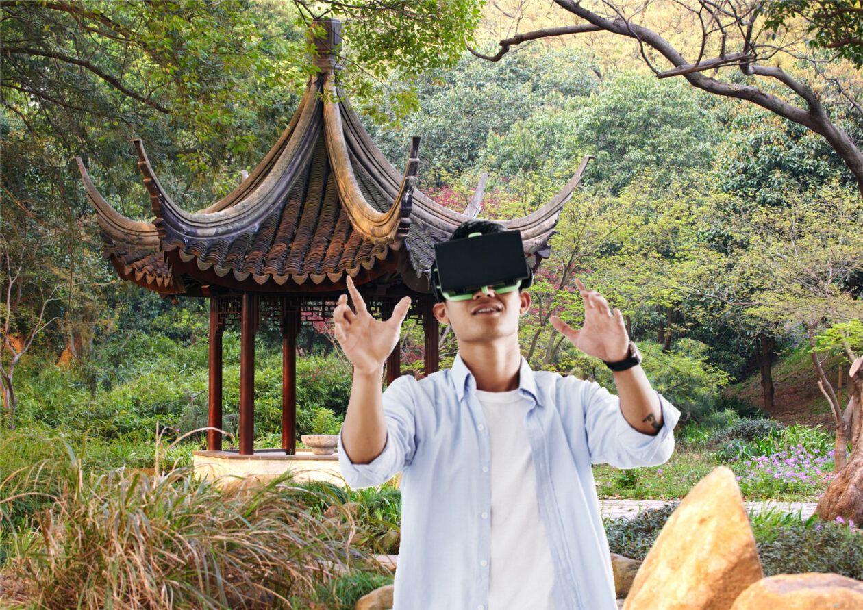A man with VR headset in front of a Suzhou Chinese garden | China’s Suzhou city joins other regions in country seeking to be metaverse hub | metaverse, China