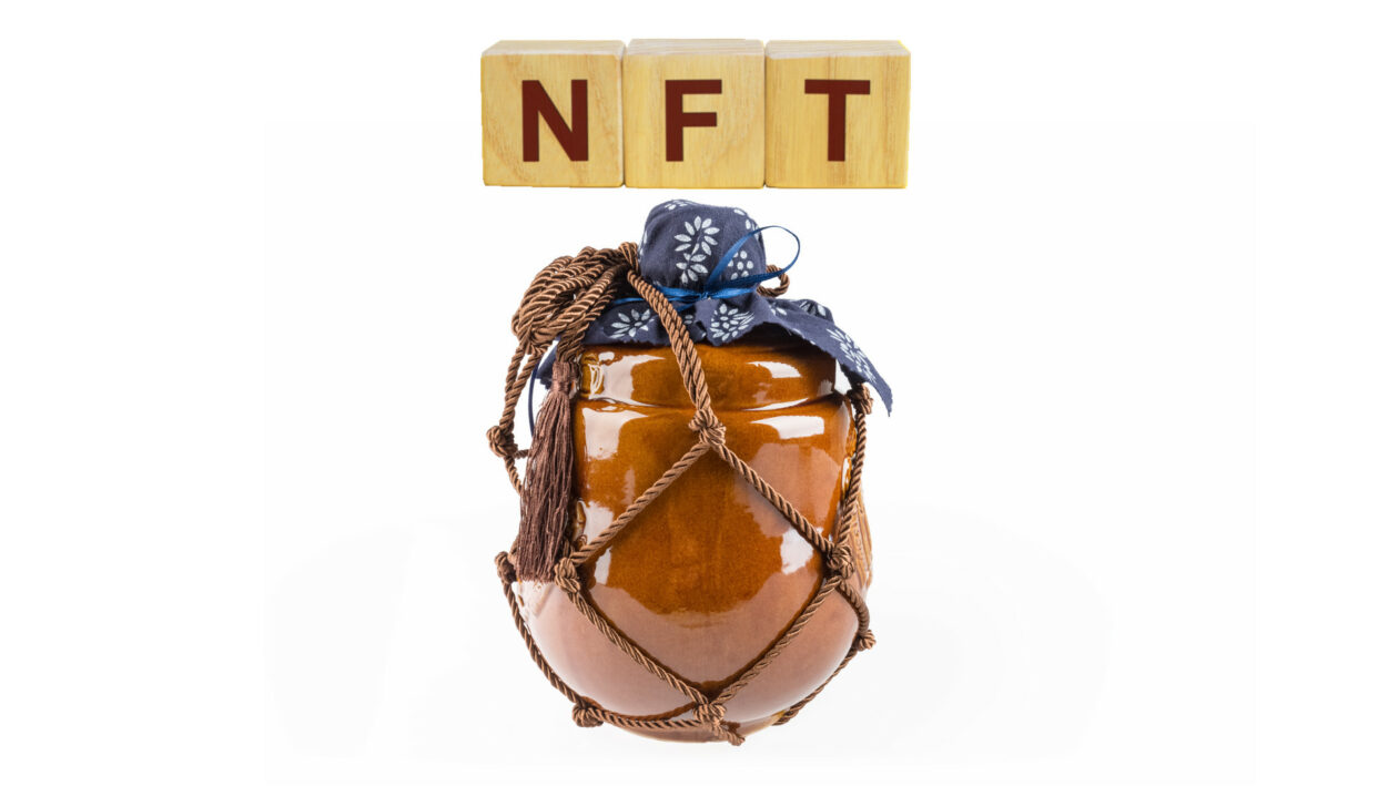 Wine bottle beneath words "NFT" | Chinese liquor giant Moutai unveils NFTs linked to liquor bottles | China, NFT-Non-fungible Token, tokenization