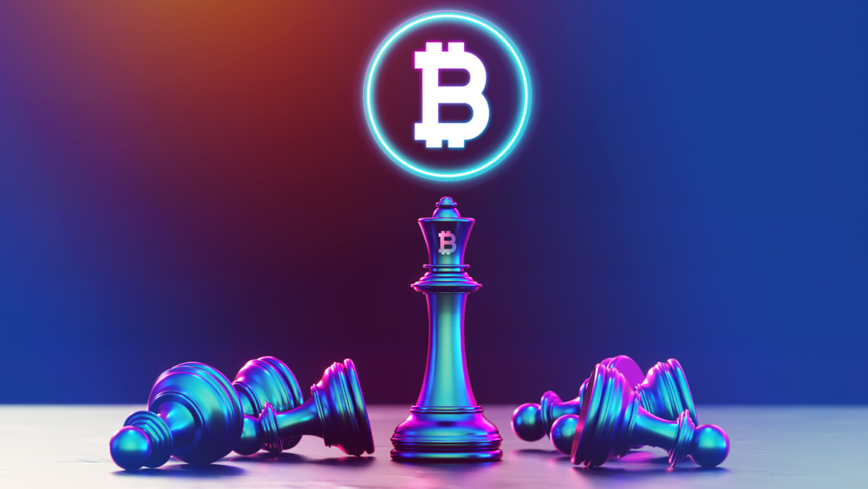 Bitcoin logo on a queen chess piece with other pieces fallen around it