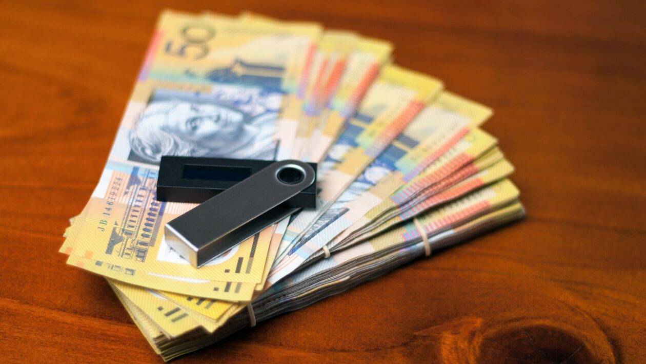 Australian dollars and nano wallet on the desk