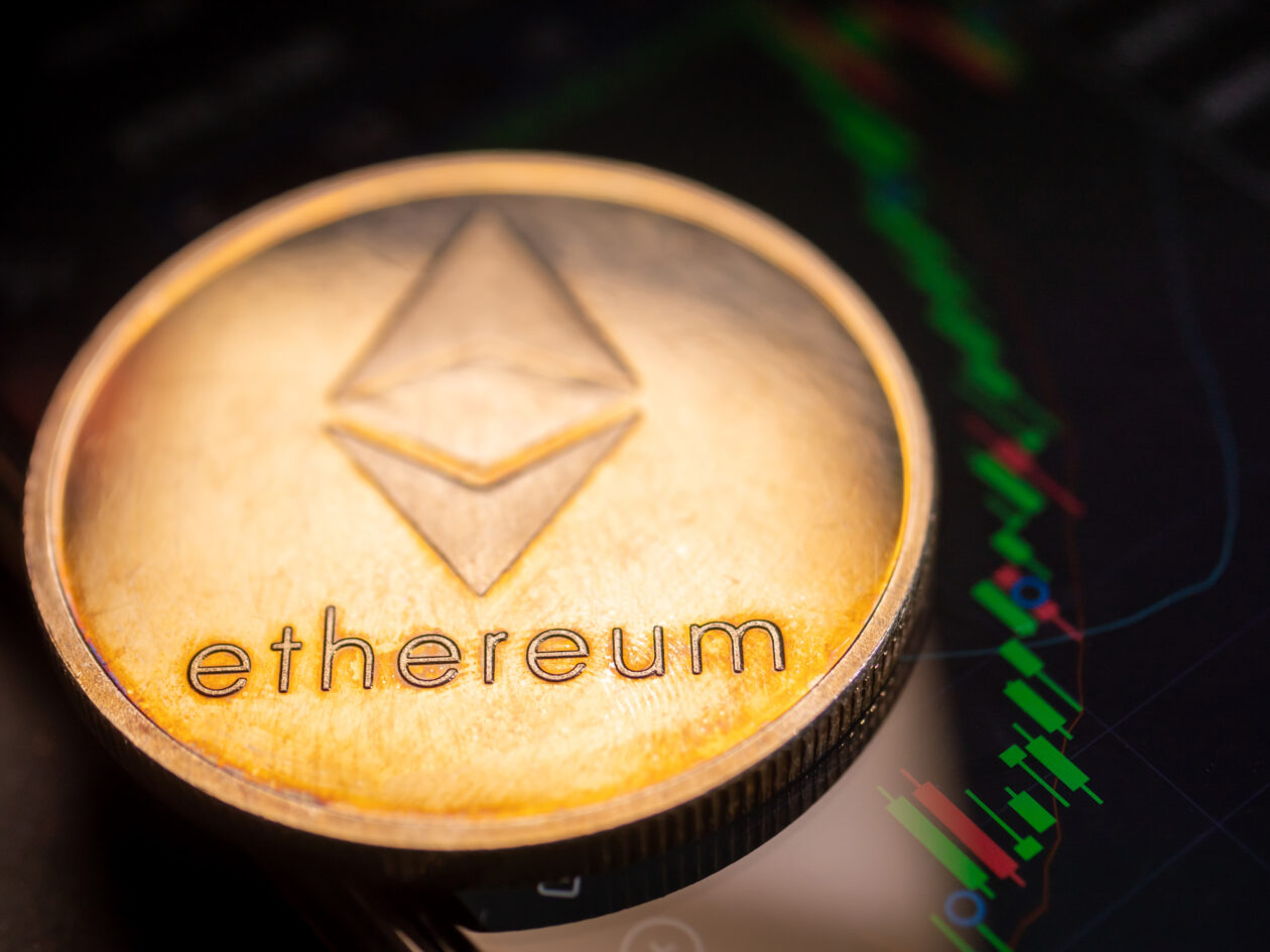 Ethereum coin with stock graph background