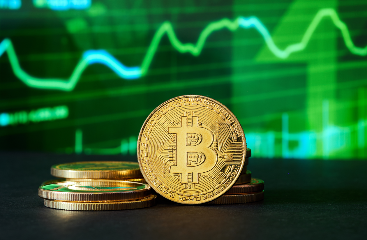 Bitcoin in front of a green chart | Bitcoin leads crypto rally as central banks promise liquidity to stem rising bank risk | Markets, BTC -Bitcoin, ETH - Ethereum, Federal Reserve, Bank