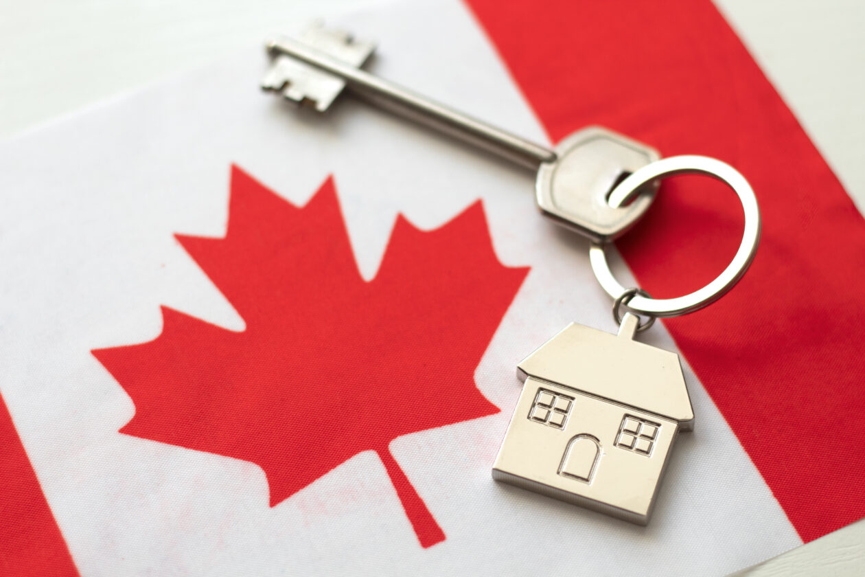 House with the flag of Canada. Immigration to Canada. Buying real estate. Houses for rent in Ottawa. Property price. Acquisition of real estate in another state.