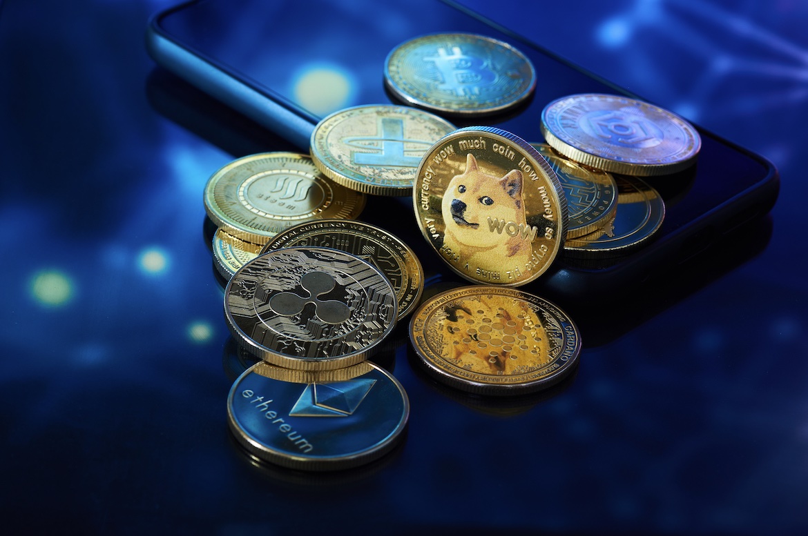Several golden cryptocurrencies highlighting the Dogecoin coin with graphics in blue color