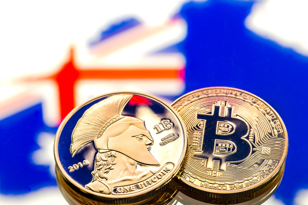 coins Bitcoin, against the background of Australia and the Australian flag, concept of virtual money, close-up. Conceptual image of digital crypto currency.